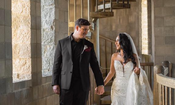 A wedding couple hand-in-hand