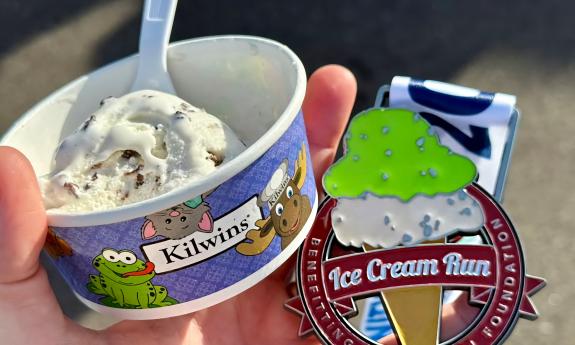 A cup of Kilwins Ice Cream and a finisher medal for the 5K Run