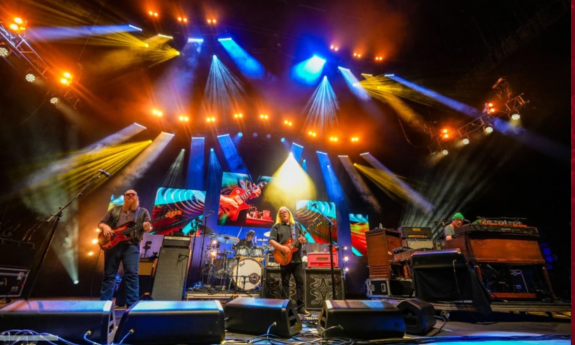 Bandmates from Gov't Mule perform live on stage.