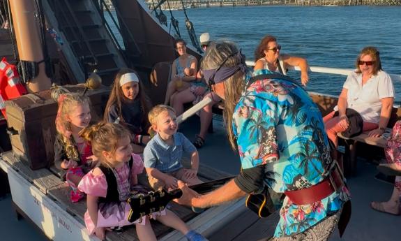 Steve the musical pirate sings sea shanties with a young crew