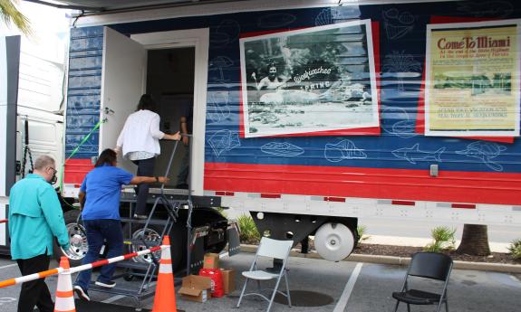 People entering the Florida Freedom Truck Mobile Museum