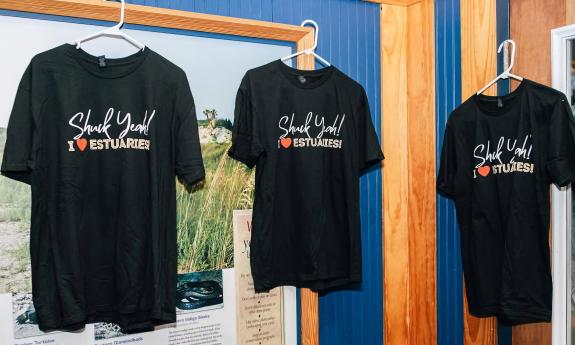 Three t-shirts from the 2025 Shuck Yeah event
