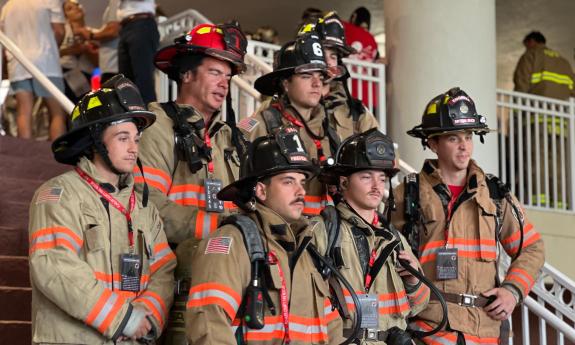 A group of six firefighters in their gear, for the 9/11 memorial climb