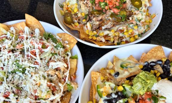 Three different plates of nachos at Pepper's