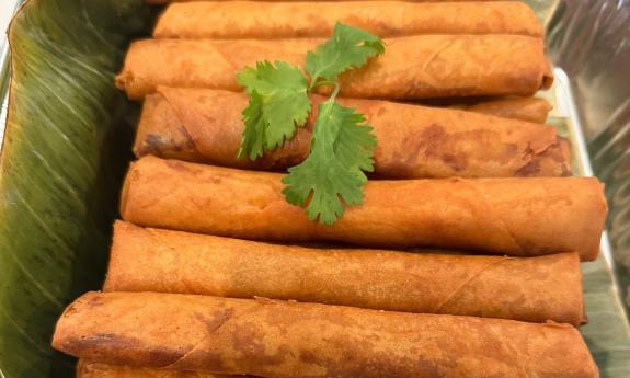 Lumpia piled in a tray