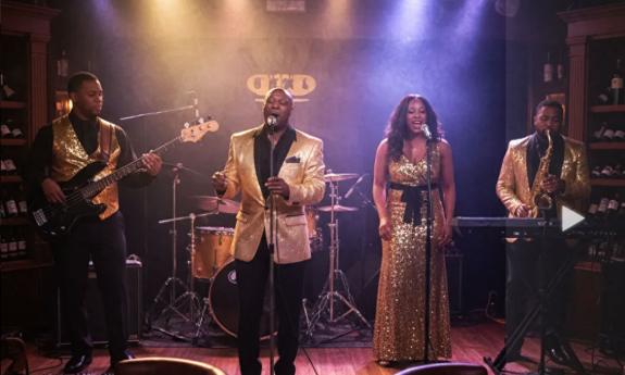 The Derryck Lawrence Project onstage, performing