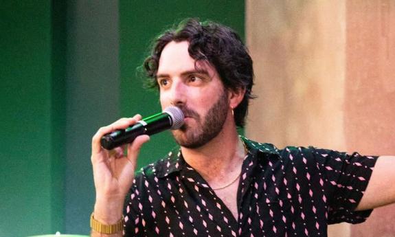 Jacob Rice singing into microphone