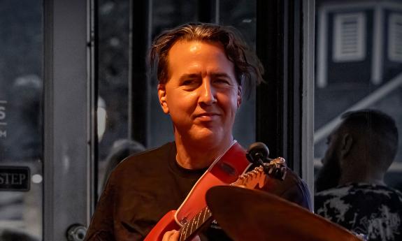 House Cats band guitarist Rino Terraciano on stage, performing