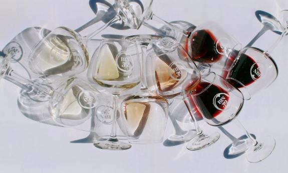 Bin 39 wine glasses on a white table in an artistic arrangement