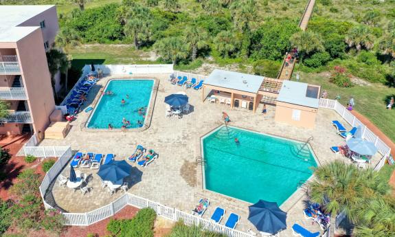 The two pools, the surrounding deck, and the walk to the beach