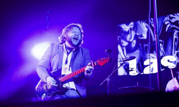 The band's frontman, Jacob Skidmore, playing guitar 