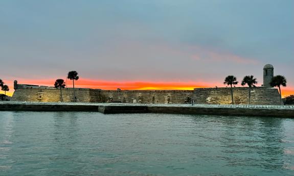 As seen from Red Boat Water Tours, the Castillo at sunset