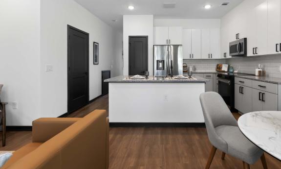 The living area in one of the apartments, seen from the sliding door