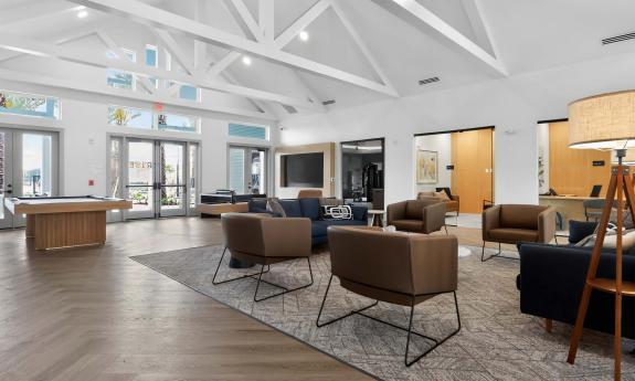 The common lounge has plenty of gathering space and a game table