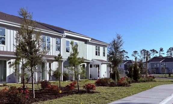The back side of a group of townhome apartments