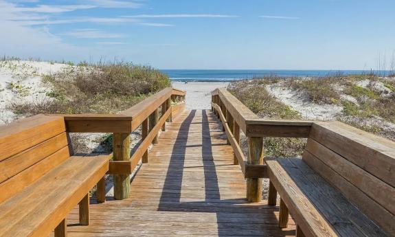 A private, gated boardwalk leads to the beach