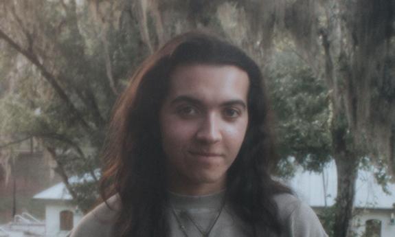 Gainesville musician Alex Willow standing outside