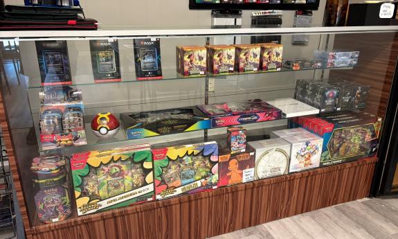 A glass display of games and cards