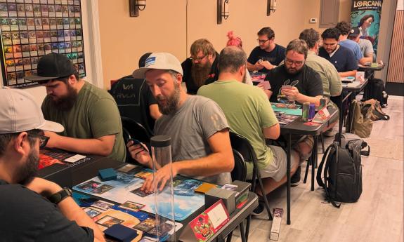 A group of people playing games at the shop