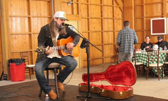 Local musician Tenessee performing at the Life-Changing Chili Cook-off