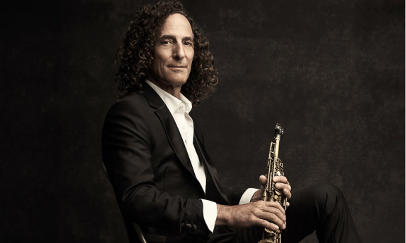 Kenny G poses with his saxophone.