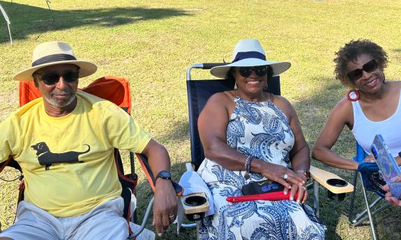 Three members of the audience for the seafood jazz fest at St. Paul AME Church