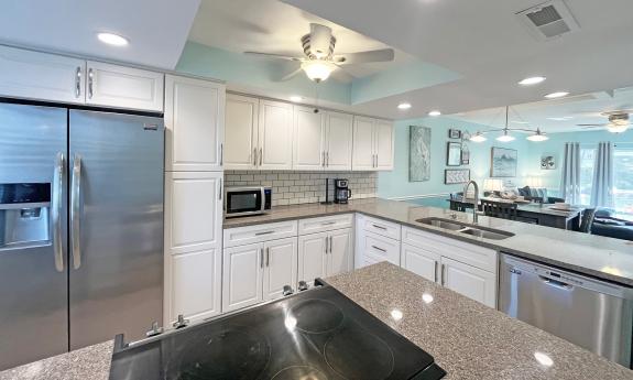 A large white kitchen a beachside condo