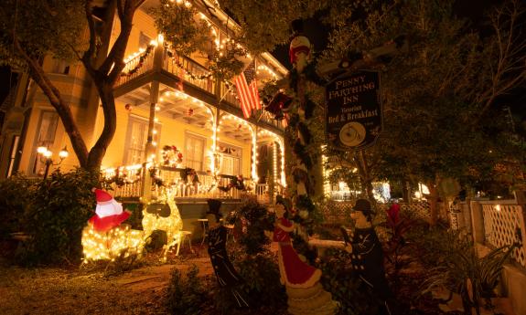 The Penny Farthing with white lights and a Santa in his sleigh