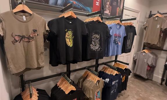 Clothing hanging on racks inside the shop