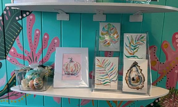 A shelf of art work
