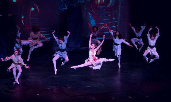 Jumping ballerinas on the stage