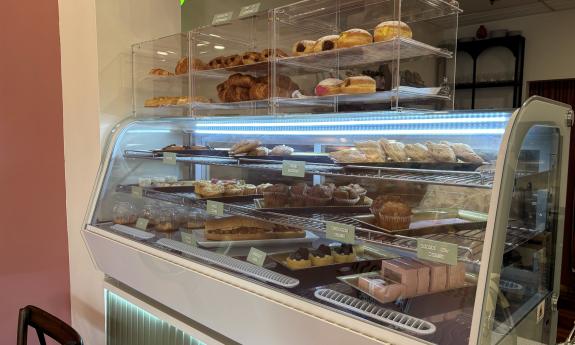 A display case filled with pastries