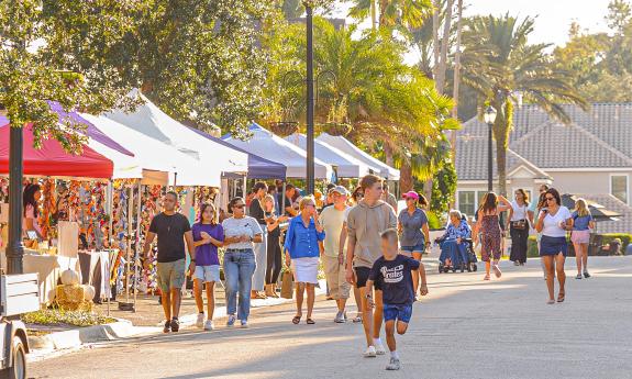 Vendor booths and the street at a local festival
