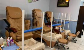 View of pedicure chairs inside of Best Nails