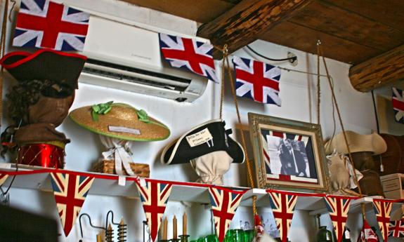 Bunting surrounds historical costumes at a reenactor's shop in St. Augustine, Florida.