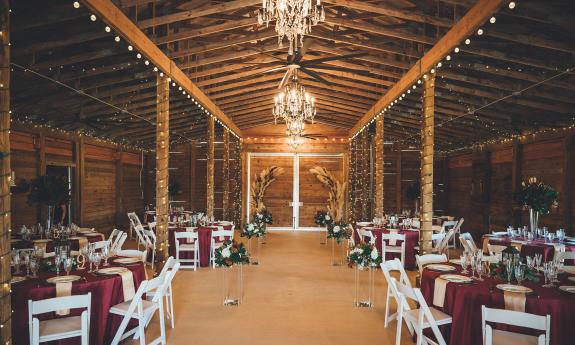 The reception area inside the barn at Kelly Farm Events. Photography by Southern Palms Studio.