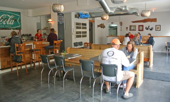 Patrons enjoying a meal inside Blue Hen Cafe in St. Augustine