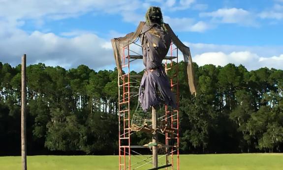 One of the burning man scarecrows at Rype & Readi Farm Market under construction.