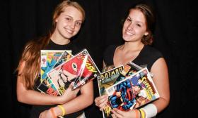 Two women shop for comic books at the Ancient City Con.