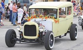 This antique yellow car is decked out with a carrot garland at the Easter Parade in St. Augustine. Photo by Jackie Hird