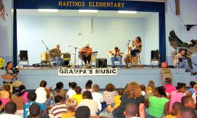 Marty Scott playing at a local school in Hastings as part of the Blues in Schools program.