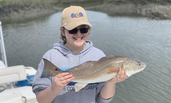 Kids catching fish on a Fishardy Charter