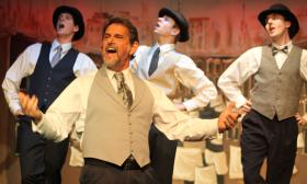 Peter Gutierrez (front) plays Horace Vandergelder in Hello, Dolly! at Limelight Theatre in St. Augustine, Fl. 