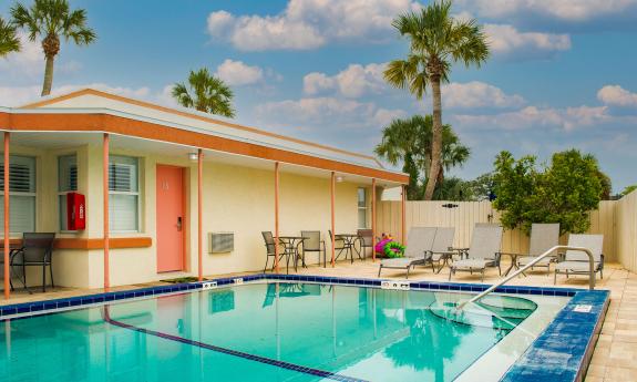 The pool at The Local - St. Augustine is inviting on a warm day and offers seating and sunbathing.