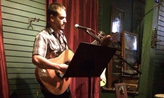 Mike Cook playing his guitar