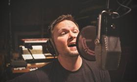 Matt Fowler singing in a recording studio