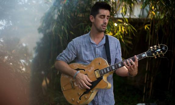 Ian Kelly with his guitar