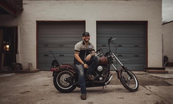 Josh Phillips on a motorcycle