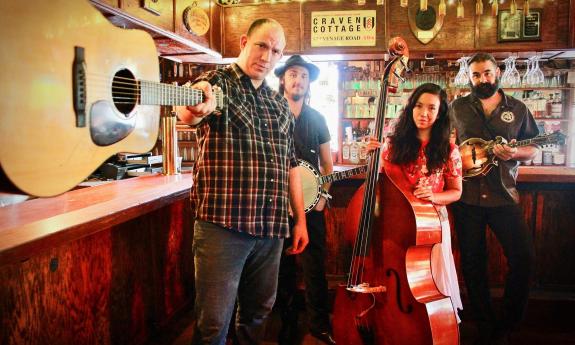 Brett Bass and Melted Plectrum posing with their instruments