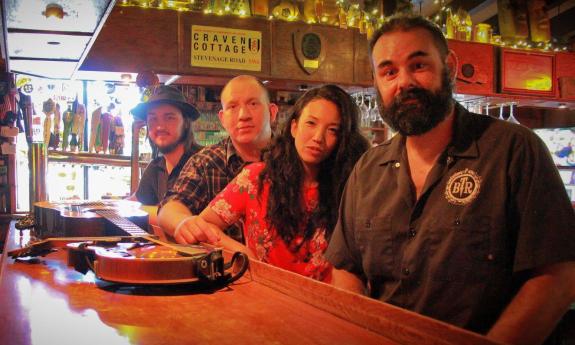 Brett Bass and Melted Plectrum sitting together at the bar